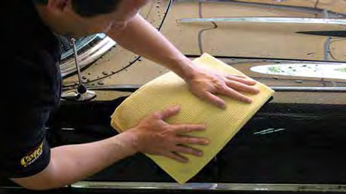 A waffle weave towel works like a “water magnet” when it comes time to dry the car’s surface.