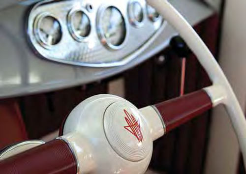 The steering wheel is a reproduction of the 17-inch wheel used in the ’40 Fords. The owner painted it to his liking, including the pinstriped horn button.