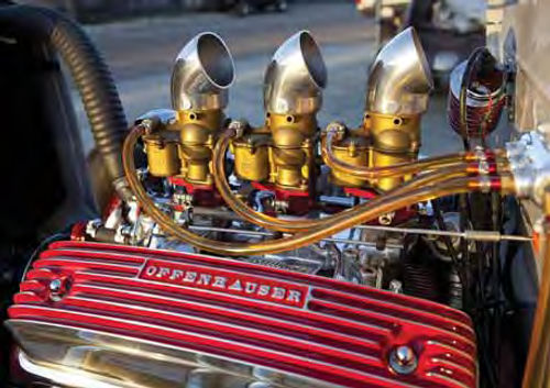 The 292-cubic-inch Ford Y-block is dressed up with reproduction Offenhauser finned valve covers that the owner accented with red paint.