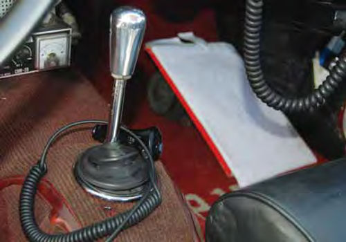 All P1800s came with a four-speed gearbox. This short, bright metal shifter handles the gear changing chores. The car has an electric overdrive unit.