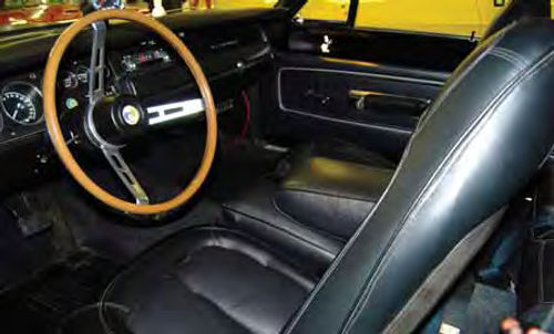 The front seats look new and the car has a desirable wood-grained steering wheel. There’s a hole in the floor where the original Pistol Grip shifter once protruded and may rest there again.