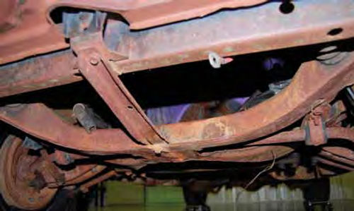 The chassis has a light coat of brown stuff on many parts, but no obvious rust-through. The owner wonders whether this should be left alone, cleaned or cleaned up and repainted to look original.