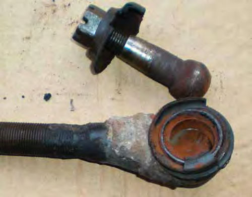 Photo 2. Here is a close view of the broken tie rod end once it was removed. Note the cracked and split boot and the fresh-looking rust.