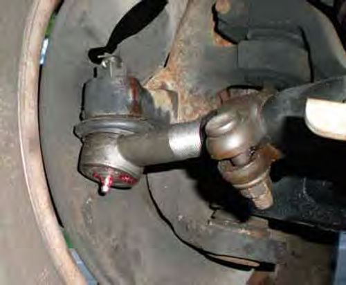 Photo 12. This tie rod end and its stud are not centered. Left in this position it can bind and wear prematurely.