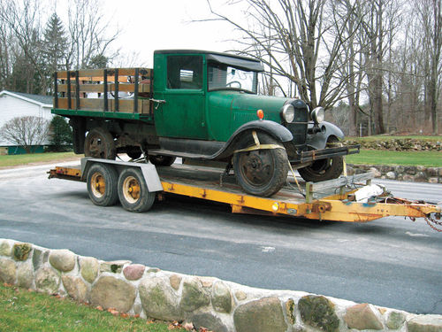 a Model AA Ford truck, is brought in.