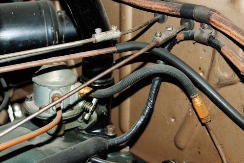 Photo 14. Flex Line, Inlet to Pump: Install a new fuel flex line, if it is over five years old. The inside surfaces collapse causing fuel flow