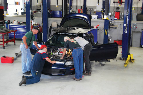 While the red car was being tuned, students and adult advisers worked on the Camaro in the school’s main shop area. The crew’s average age was probably 40 although half were students, former students and friends in their 20s.