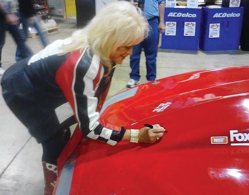 Bonneville crew members young and old were appreciative when Linda Vaughn, the famous former Hurst “Miss Golden Shifter,” applied her signature to the hood of the Firebird at the Muscle Car & Corvette Nationals in Chicago.