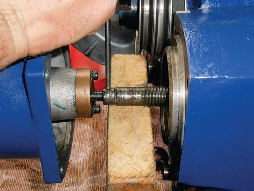 Photo 5. Support the union and threaded rod with a block of wood, and then drive out the roll pin.