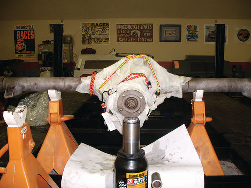 Towels soaked with Evapo-Rust were covered with clear plastic to keep the liquid from drying and the plastic was kept tightly wrapped with bungee cords.