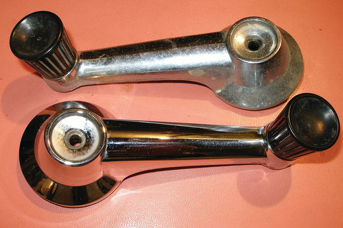 Photo 32. Some light buffing returned a deep shine (bottom) to the formerly flat-looking window regulator handles (top).