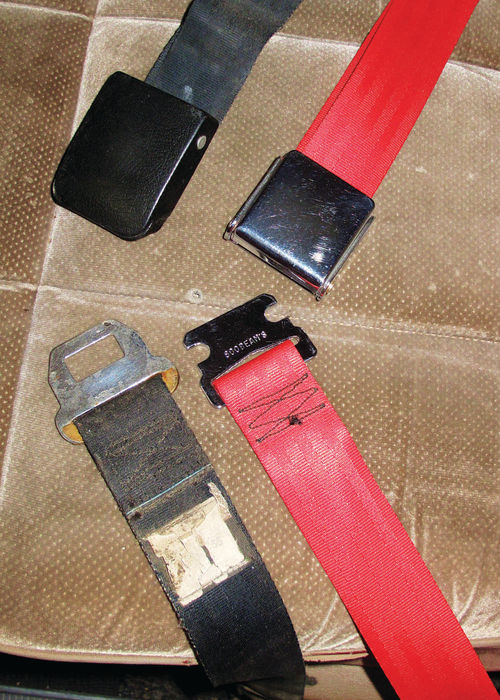 Photo 39. Besides being safer than the weathered black originals, the new red belts add a splash of color to the interior.