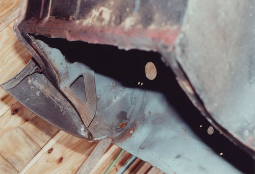 Photo 3. A view from under the driver’s side after the trunk floor has been cut out.