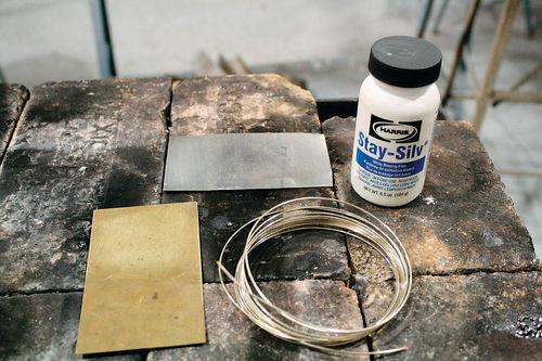 Next, to demonstrate silver soldering, we rounded up a piece of brass, some mild steel, some silver soldering flux, and wire silver solder.