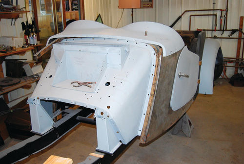 When formed to the proper curvature, the 1952 MG TD front quarter panel attached perfectly and made the fit between it and the door much tighter.