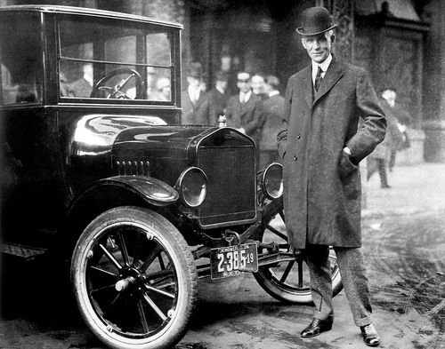 Henry Ford with one of his world-famous Model T cars in 1921.