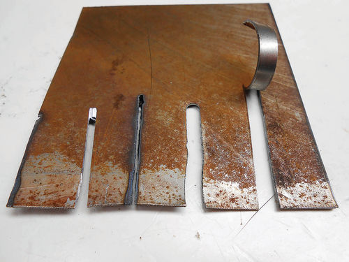 Photo 13. Here are some comparison cuts between (left to right) a metal saw, plasma, an air nibbler and electric shears.