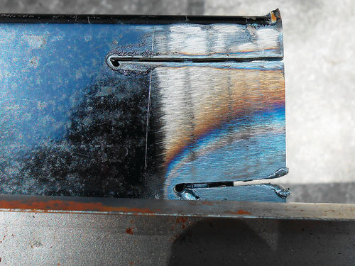 Photo 16. Note the wide fan of metal discoloration representing the heat-affected zone from an oxyacetylene torch cut (lower) compared with a plasma cut.