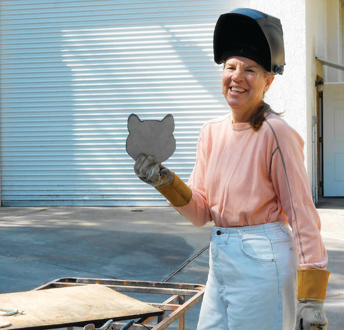 Photo 20. Proudly she holds up her project, but the eyes and whiskers still need to be added.