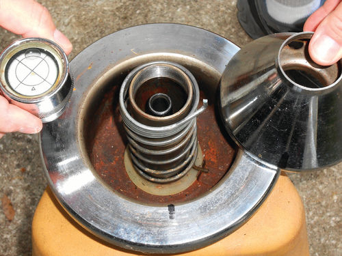 Photo 5. The level bubble threads off to allow removal of the centering cone which exposes the spring
