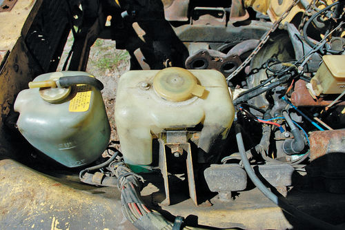 The washer and coolant tanks before (top) and after.