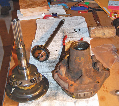 5. The reverse unit output shaft on the left has to be driven out of the cast iron housing on right so the governor drive gear can be replaced.