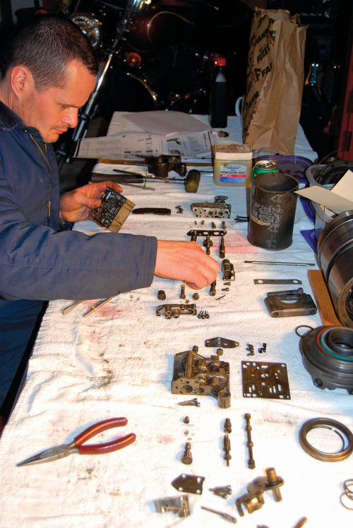 6. Vince carefully laid out the CVA parts like the illustration in the repair manual.