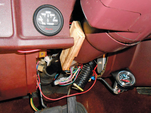 Photo 8. A couple of small wood blocks were used to force the steering column inward for more space.