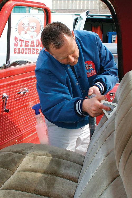 Photo 60. Kevin Hestermann uses a truck-mounted machine to deep-clean Ruby’s stinky seat.