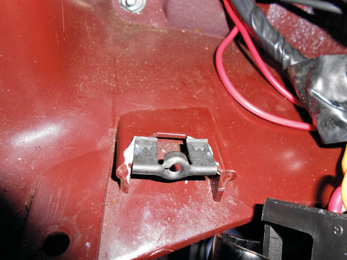 Photo 39. The lower dash mount was suffering from broken plastic, so JB Weld was used to help secure the clip.