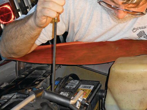 6. This long screwdriver can clear a lot of obstacles and easily reach the lower radiator hose clamp.