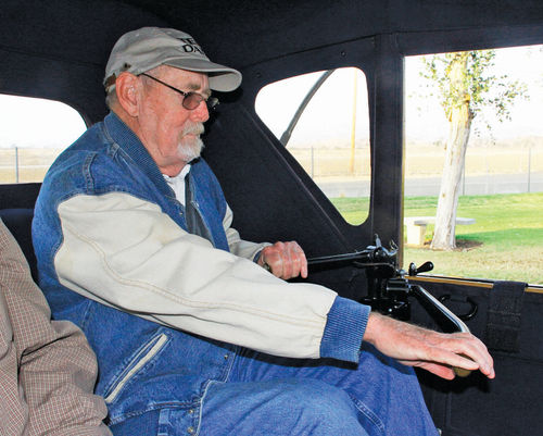 Author Jim Richardson makes a hard right at full throttle, putting the Detroit Electric through its paces.