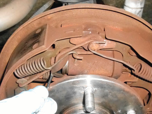 Photo 19. Pull the boot away from the wheel cylinder and look for fluid leakage. Leakage calls for replacement.
