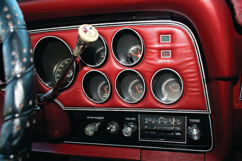 Full instrumentation was clustered ahead of the driver for easy viewing. The AM/FM stereo was an extra-cost option.