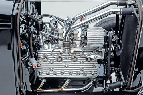 This engine is based on a French block fitted with 4-inch SCAT crankshaft and H-beam rods, ported and relieved, 1.6-inch intake valves, Isky 400 Jr.