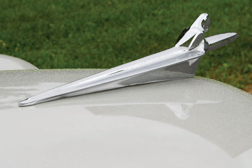 Hood ornaments, if not the works of art often seen during the Classic era, could still be unrestrained during the postwar years.