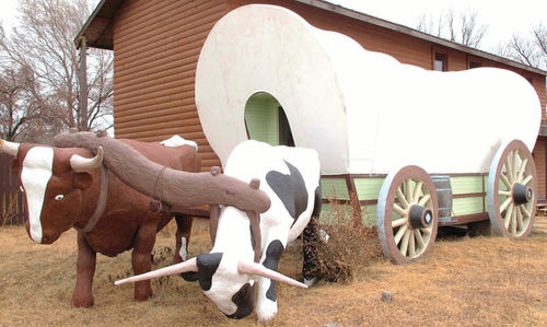 Old (top) and new photos encouraged Moon Car Club members to visit the Covered Wagon, a 1932 highway landmark just west of Kearney.