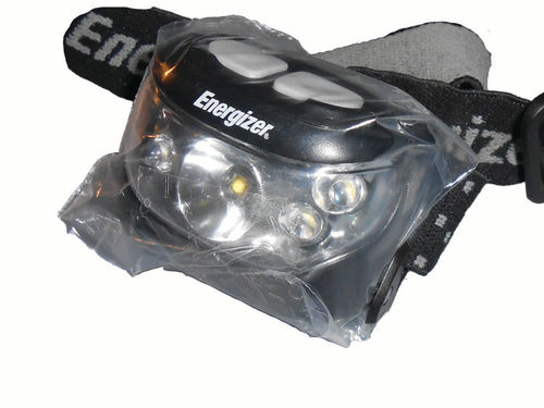 A protective headlight wrap was formed from a sandwich bag for an overhead painting project.