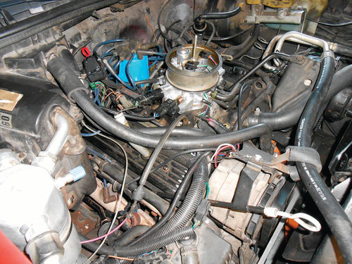 Photo 4. There are a number of obstacles before the valve covers or intake can be removed.