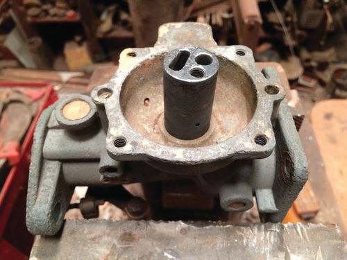 Here’s Ernie’s Ensign carburetor split in half with its troublesome cylinder in the middle.