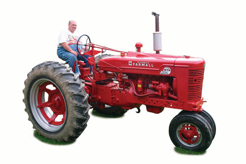 Jack Thompson, of Marietta, New York, on the Farmall tractor that was added to the growing group at the 2014 Empire Farm Days agricultural show. Howard Hemminger Photo