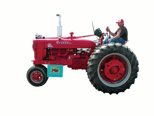 Marvin Adams drives his ’54 Farmall in the 2015 Old Iron Parade at Empire Farm Days in Seneca Falls, New York.