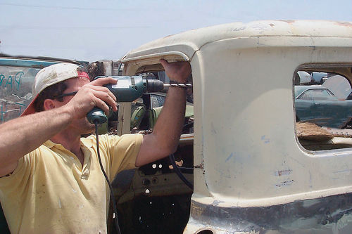 Separate the small back window from its spot-welds just as you did with the patch panel.