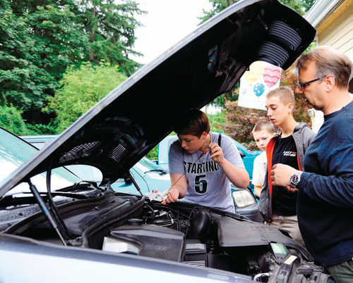 Checking fluid levels of a BMW X5.