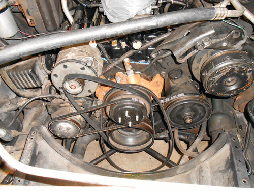 To access the front casting plugs, the alternator, power steering and AIR pump need to be removed.