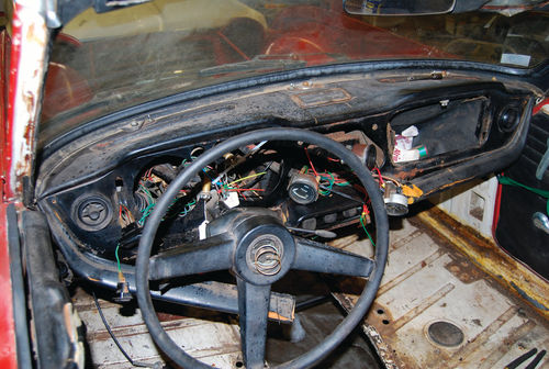 Removing the wooden fascia required removal of gauges, so the dashboard, which already looked pretty rough, took on this ugly appearance.