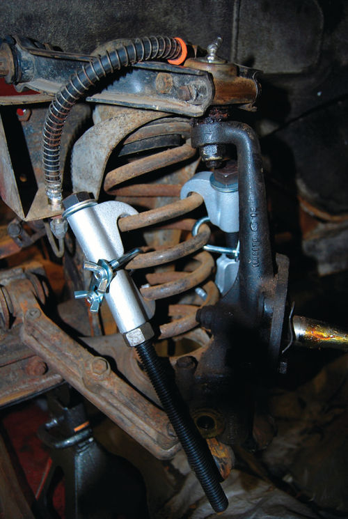 An Eastwood external spring compressor was used to compress coil springs. It is actually designed for use on larger coil springs, but it did the job well.