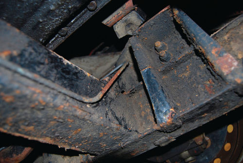 The front “leg” of this frame bracket has a very typical horizontal crack in it a little over halfway up. Reinforcement plates are needed here.