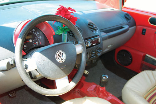 The trademark Volkswagen Beetle bud vase was retained on the dashboard.