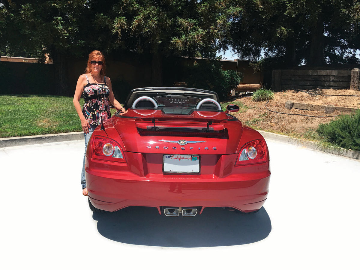 Elaine likes to drive her Crossfire with the rear spoiler up.